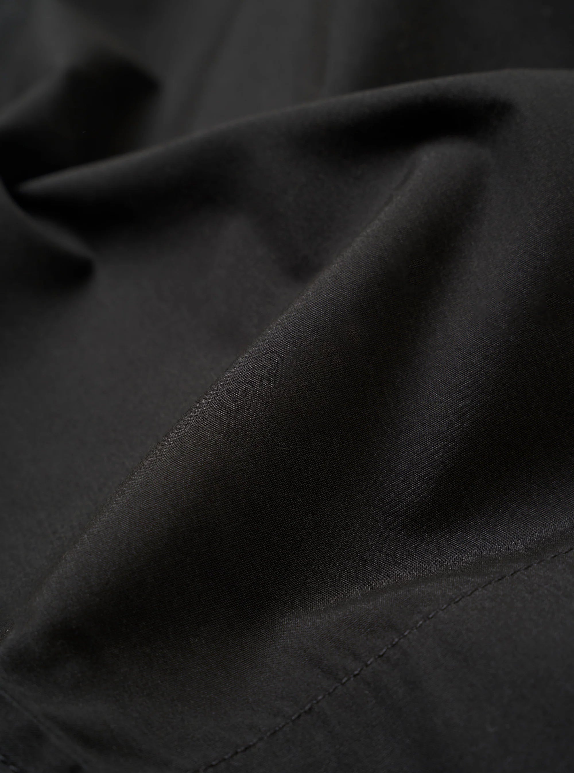 PLEATED TRACK SHORT - BLACK RECYCLED POLY TECH